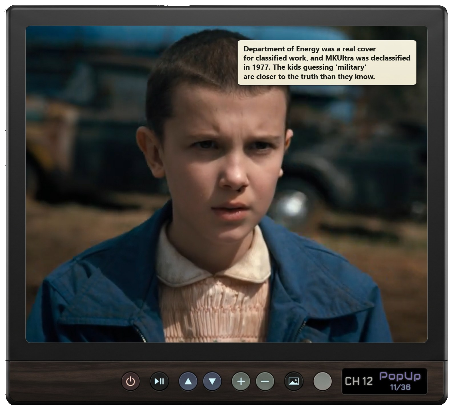 Black and Walnut PopUp Tube cabinet showing Stranger Things with a timed PopUp card.